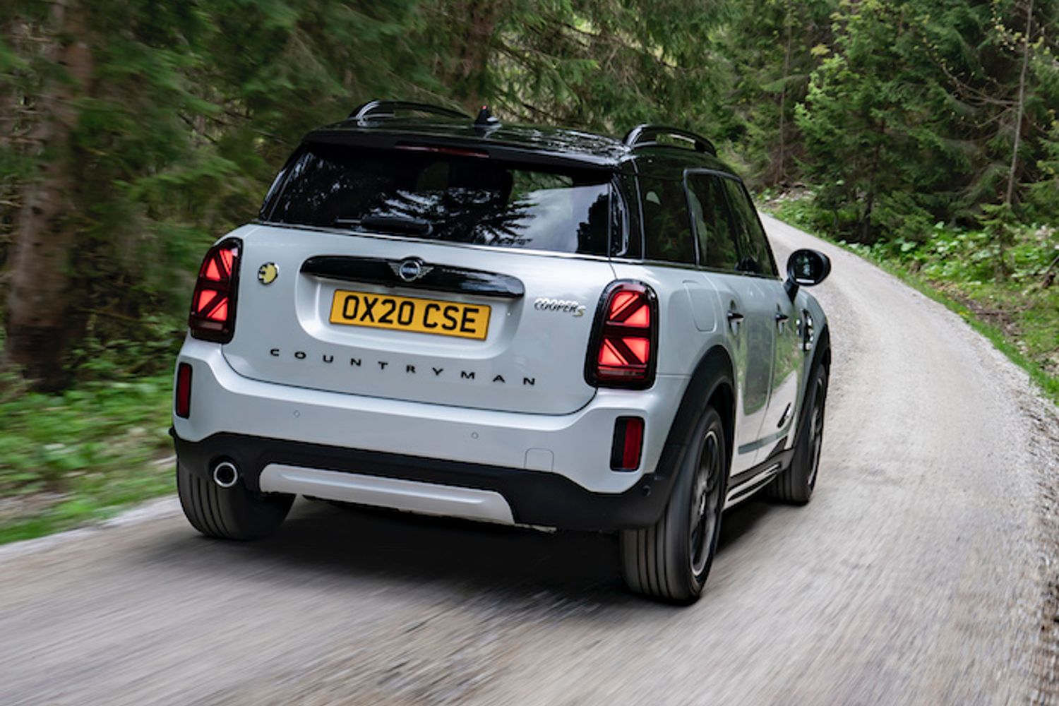 Mini Countryman PHEV exterior rear driving in forest